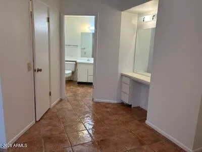 a view of a bathroom with mirror