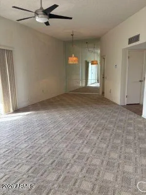 an empty room with a empty space and windows