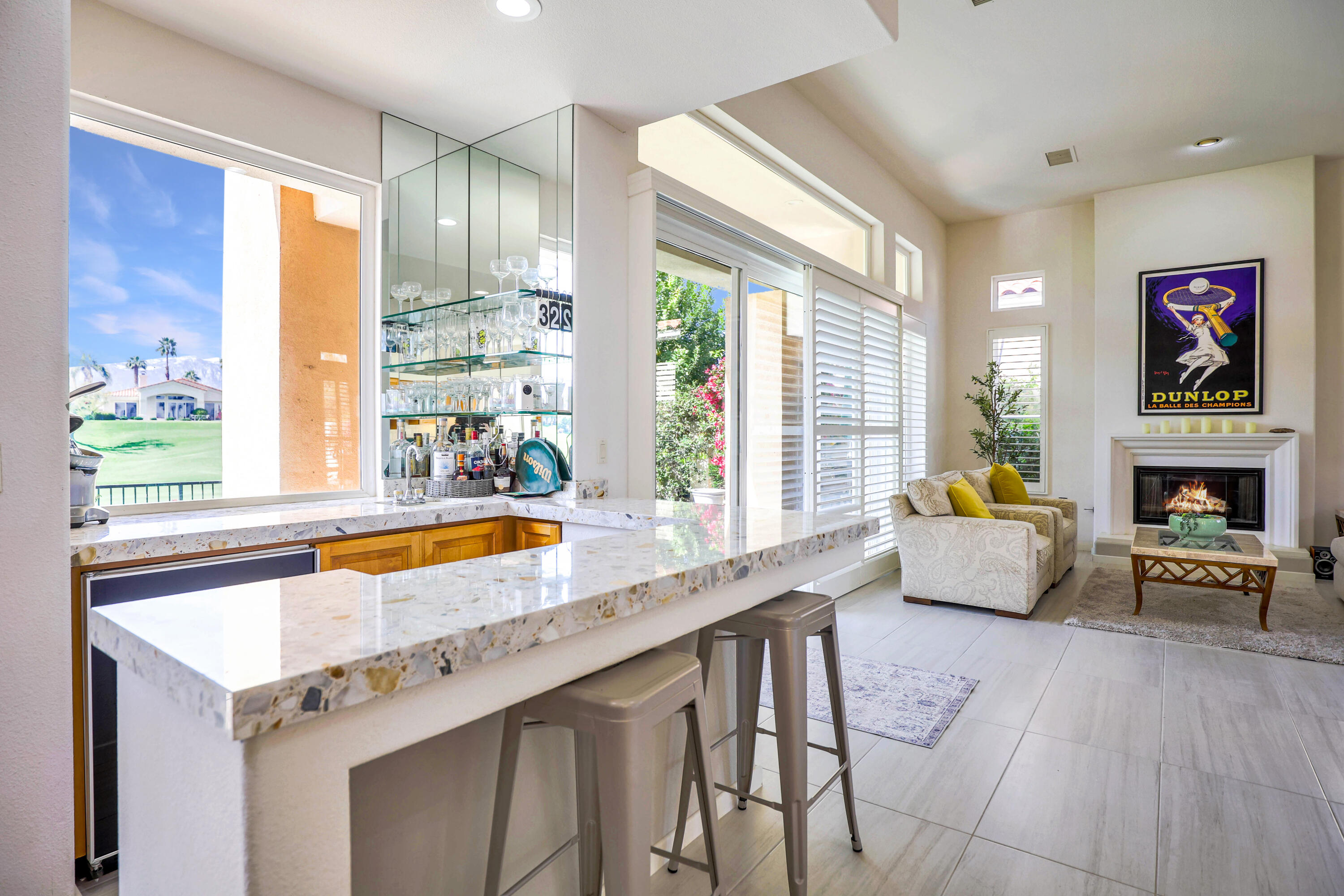 371 Tomahawk Drive Palm Desert, CA 92211 - Photo 14 of 34 a living room with furniture and a fireplace
