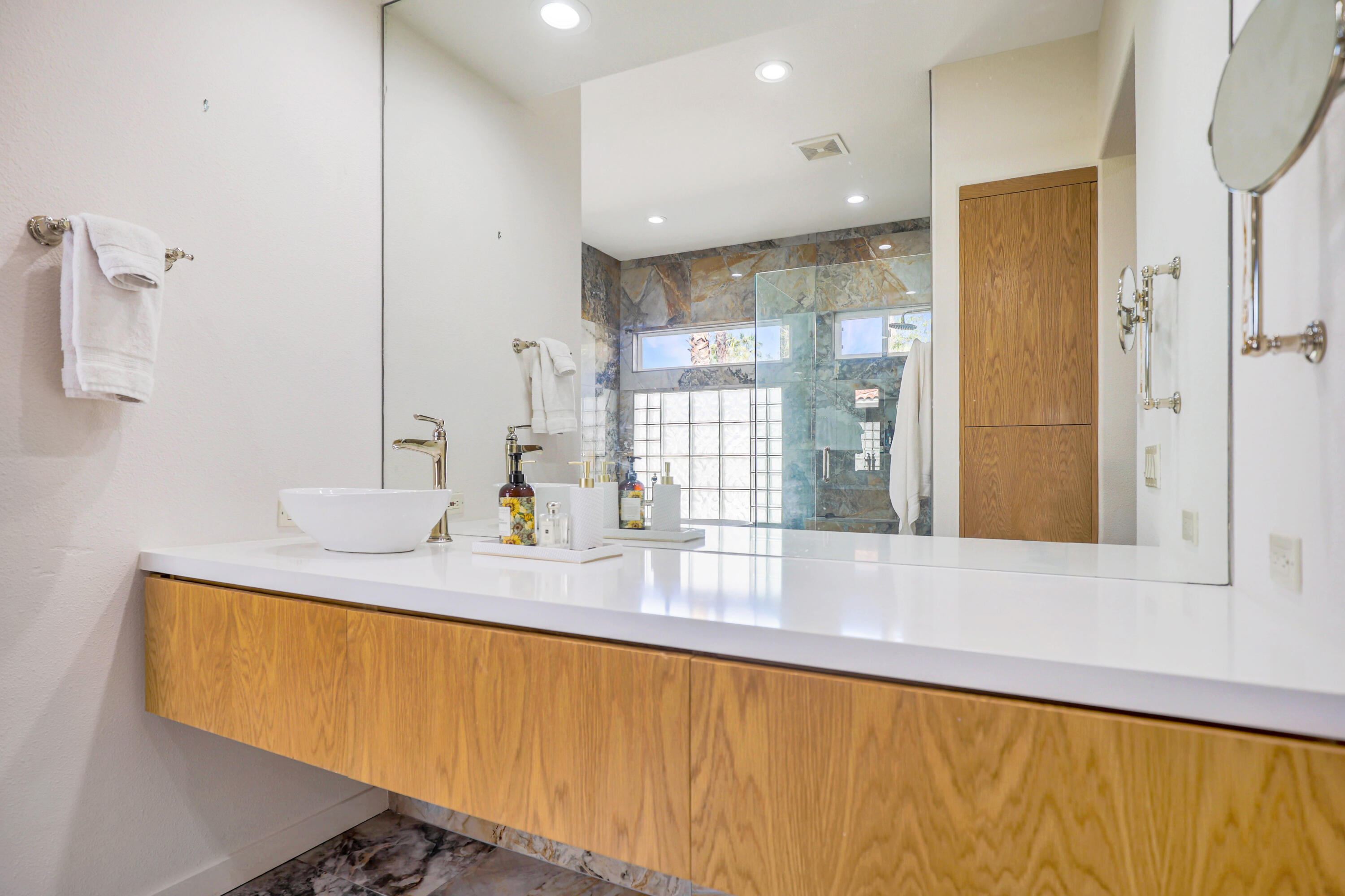 371 Tomahawk Drive Palm Desert, CA 92211 - Photo 24 of 34 a kitchen with stainless steel appliances granite countertop a sink a refrigerator and a granite counter tops
