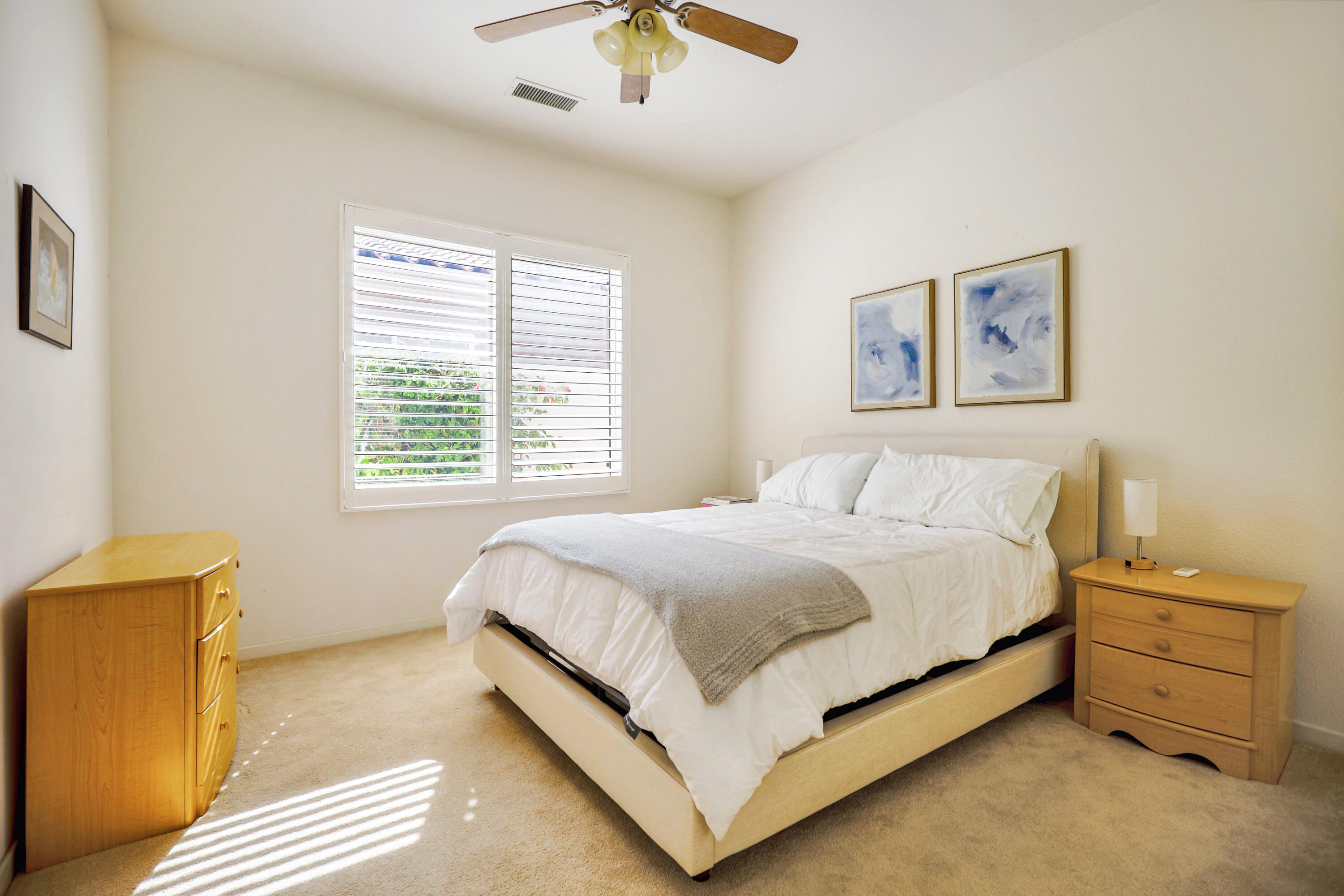 371 Tomahawk Drive Palm Desert, CA 92211 - Photo 25 of 34 a bed sitting in a bedroom next to a window