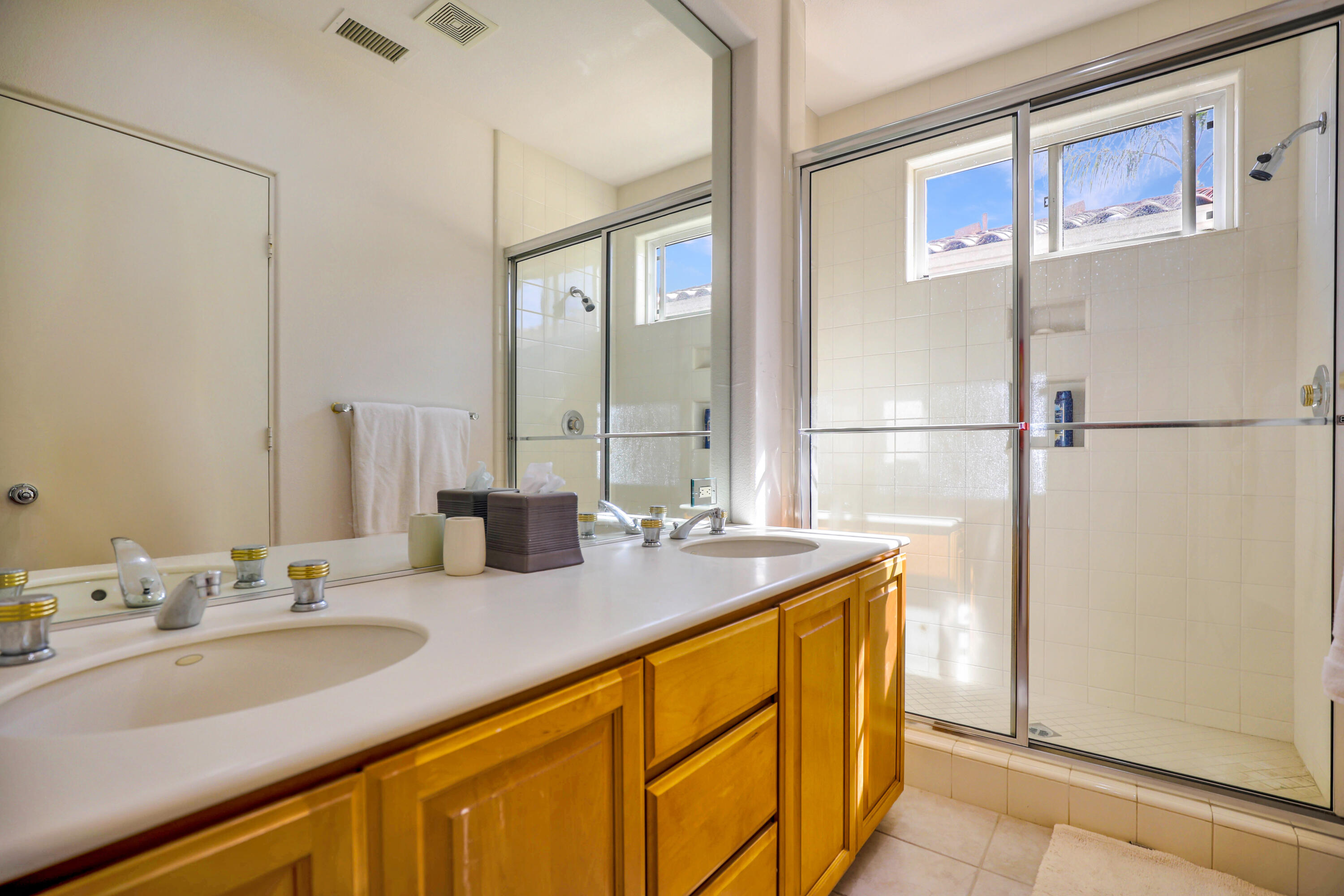 371 Tomahawk Drive Palm Desert, CA 92211 - Photo 27 of 34 a bathroom with a sink double vanity and a mirror