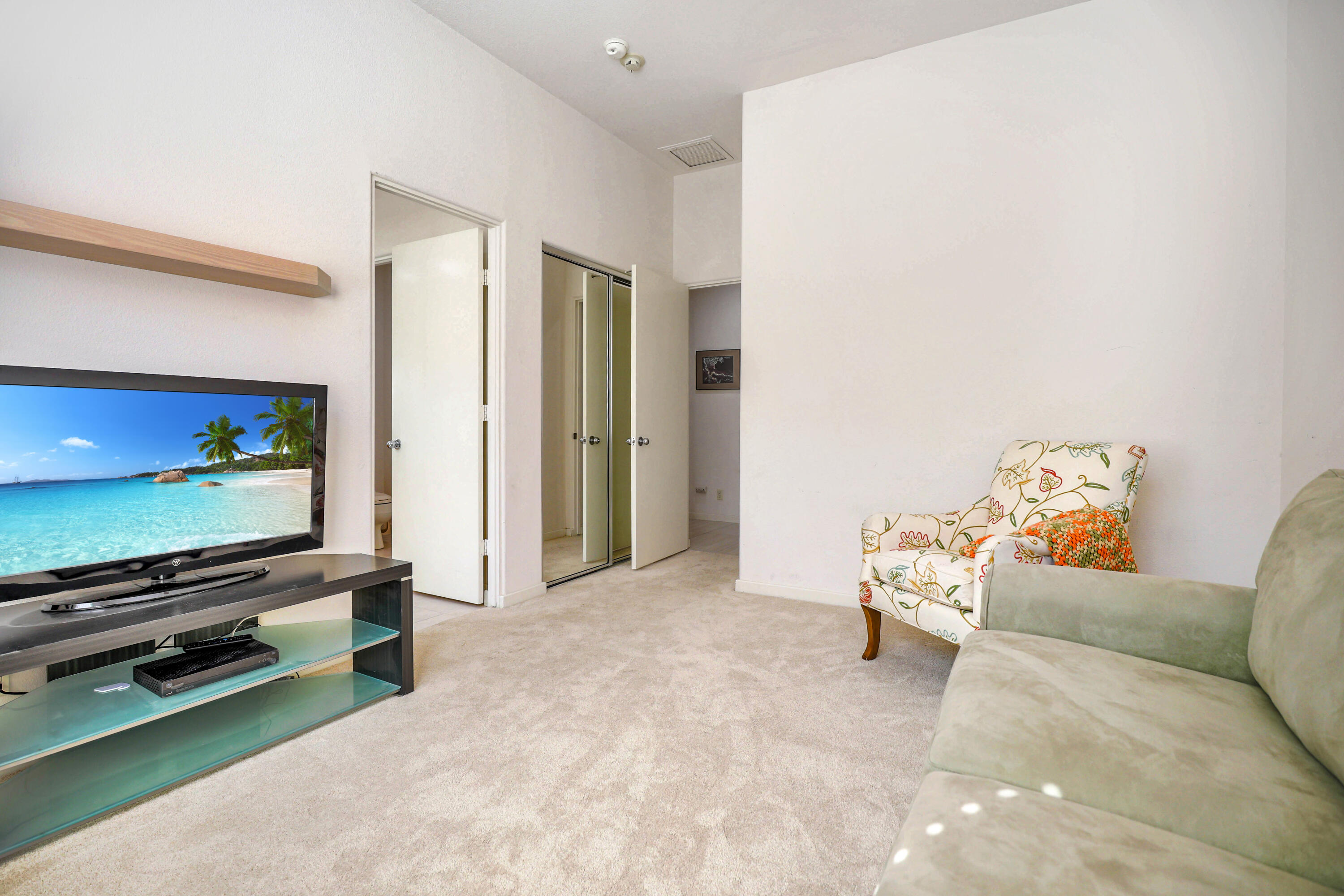 371 Tomahawk Drive Palm Desert, CA 92211 - Photo 29 of 34 a living room with furniture and a flat screen tv