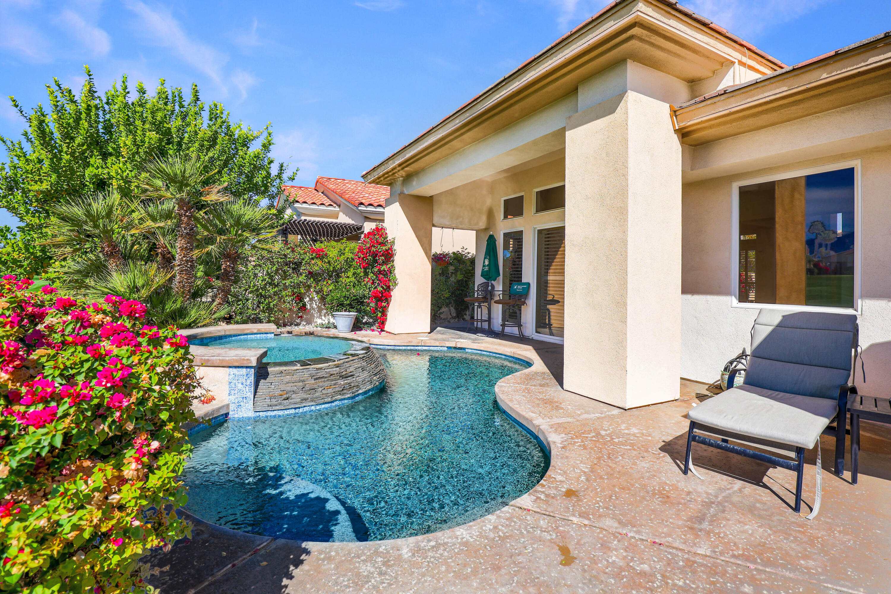 371 Tomahawk Drive Palm Desert, CA 92211 - Photo 31 of 34 a view of a house with backyard sitting area and garden