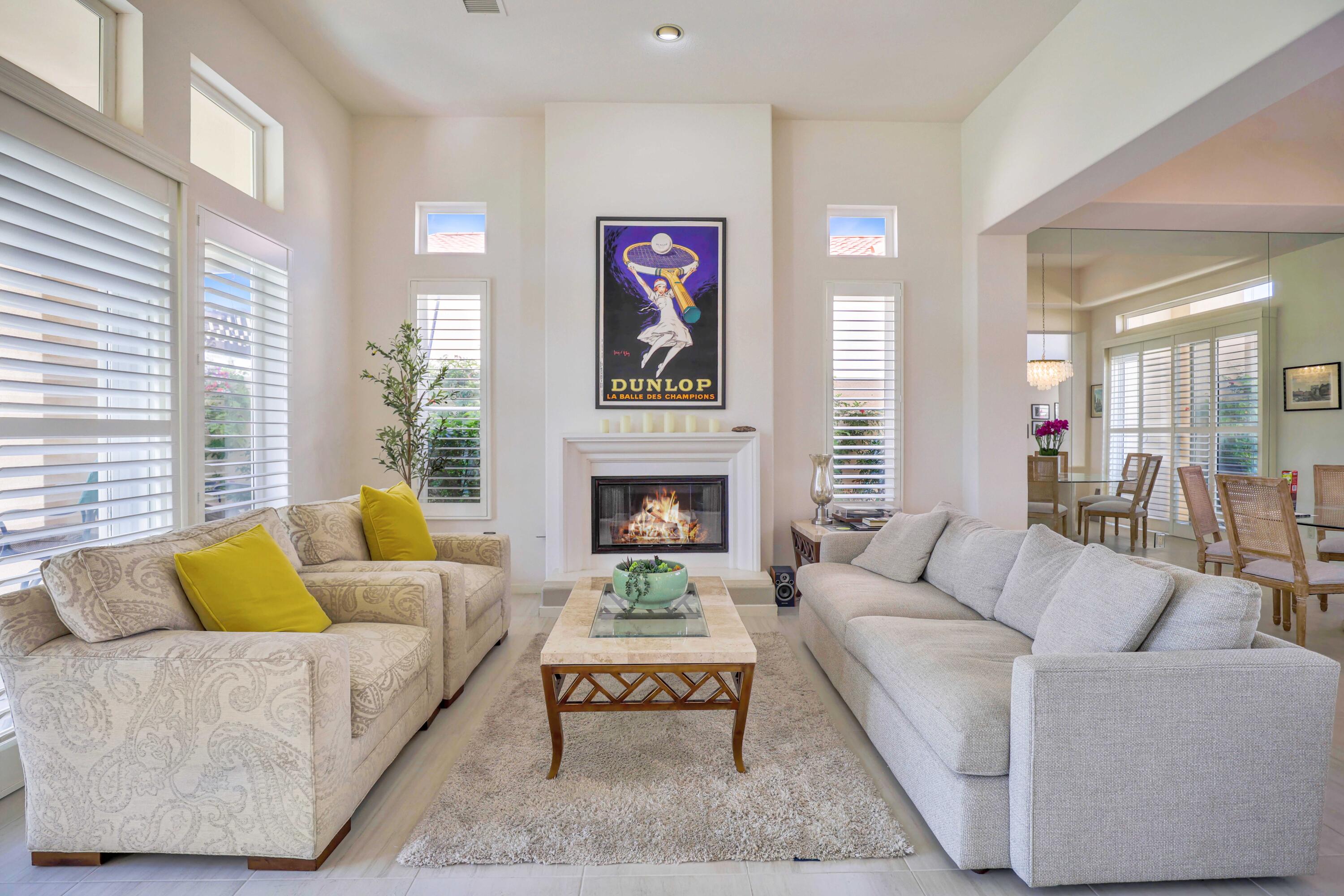 371 Tomahawk Drive Palm Desert, CA 92211 - Photo 7 of 34 a living room with furniture and a fireplace