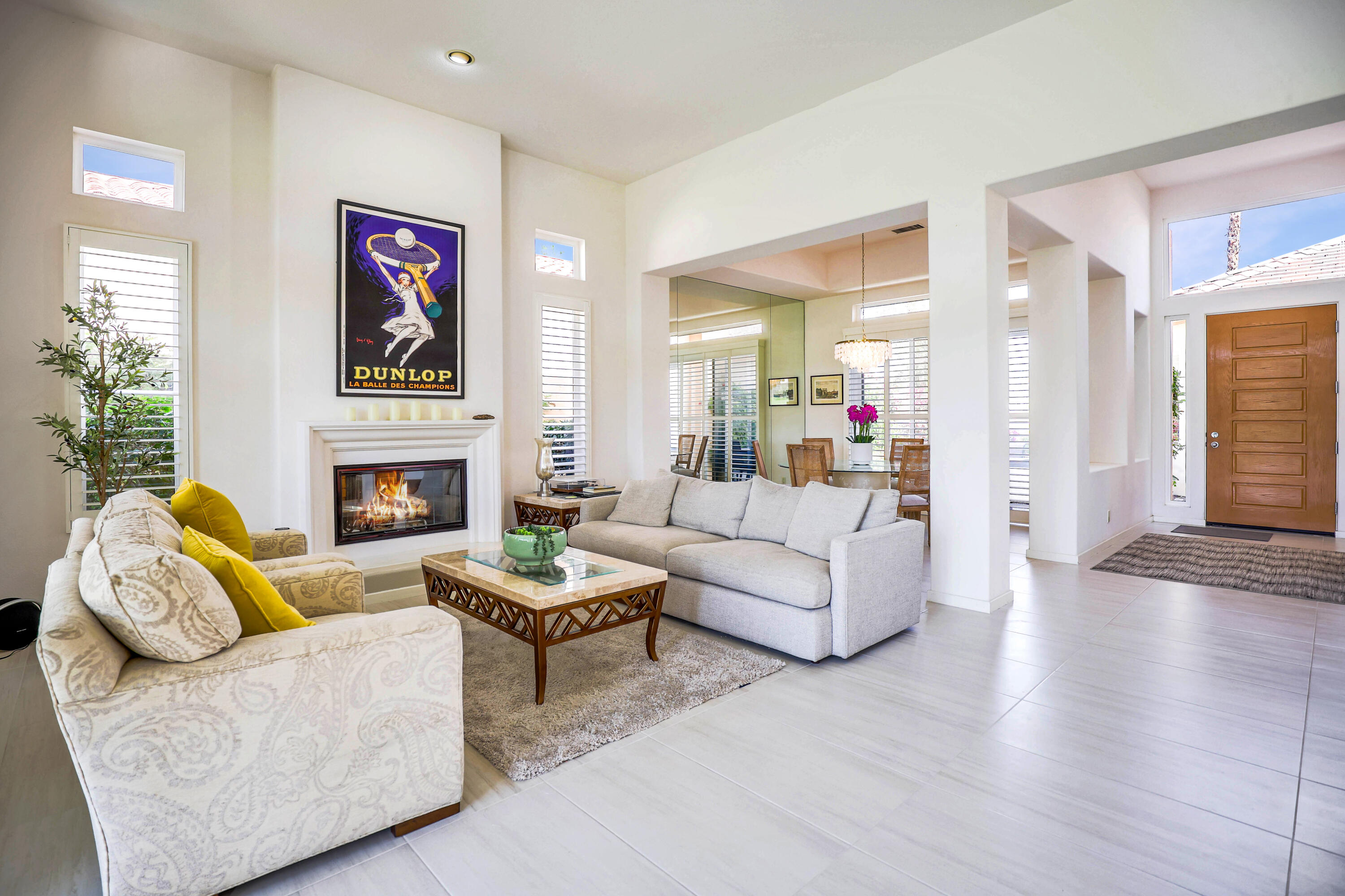 371 Tomahawk Drive Palm Desert, CA 92211 - Photo 9 of 34 a living room with furniture and a fireplace