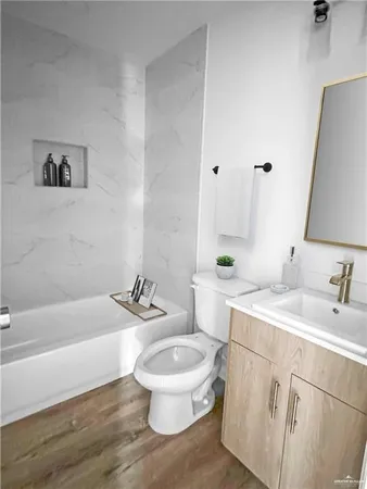 a bathroom with a sink a toilet and a bathtub