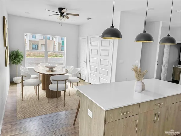 a dining room with furniture and window