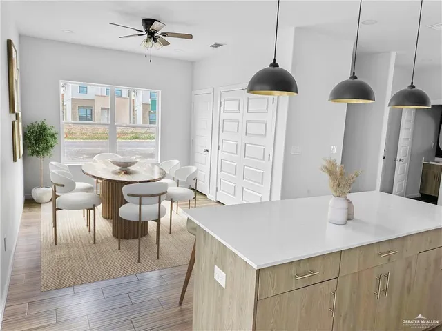 a dining room with furniture and window