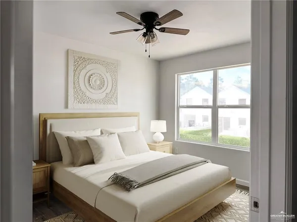 a bedroom with a bed and a window