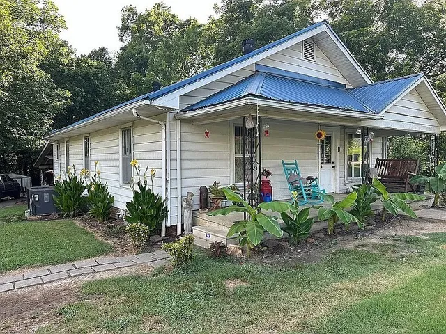 a front view of a house with garden