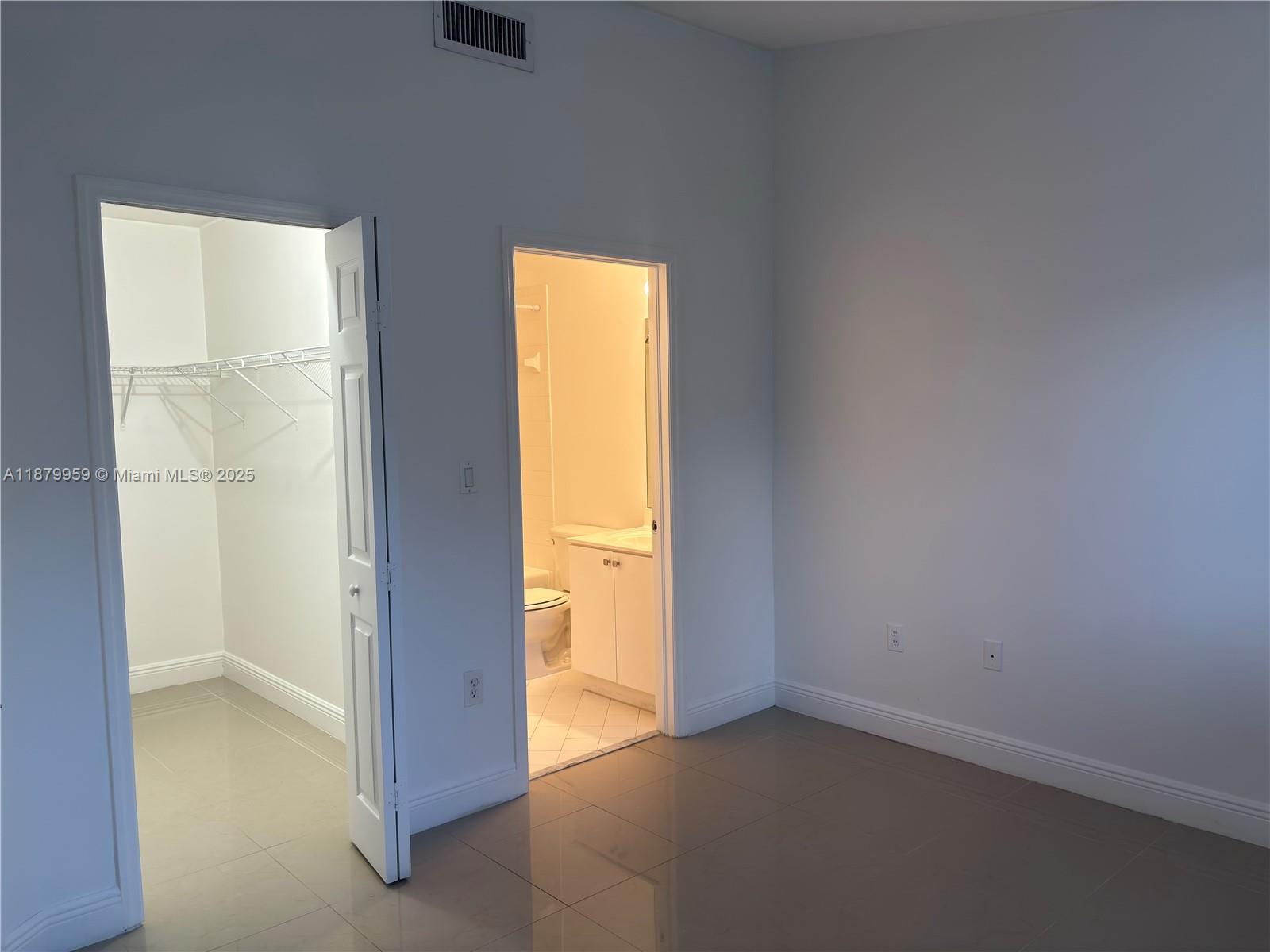 2721 Southeast 12th Place, Unit 205 Homestead, FL 33035 - Photo 11 of 15 Walking closet/bathroom door