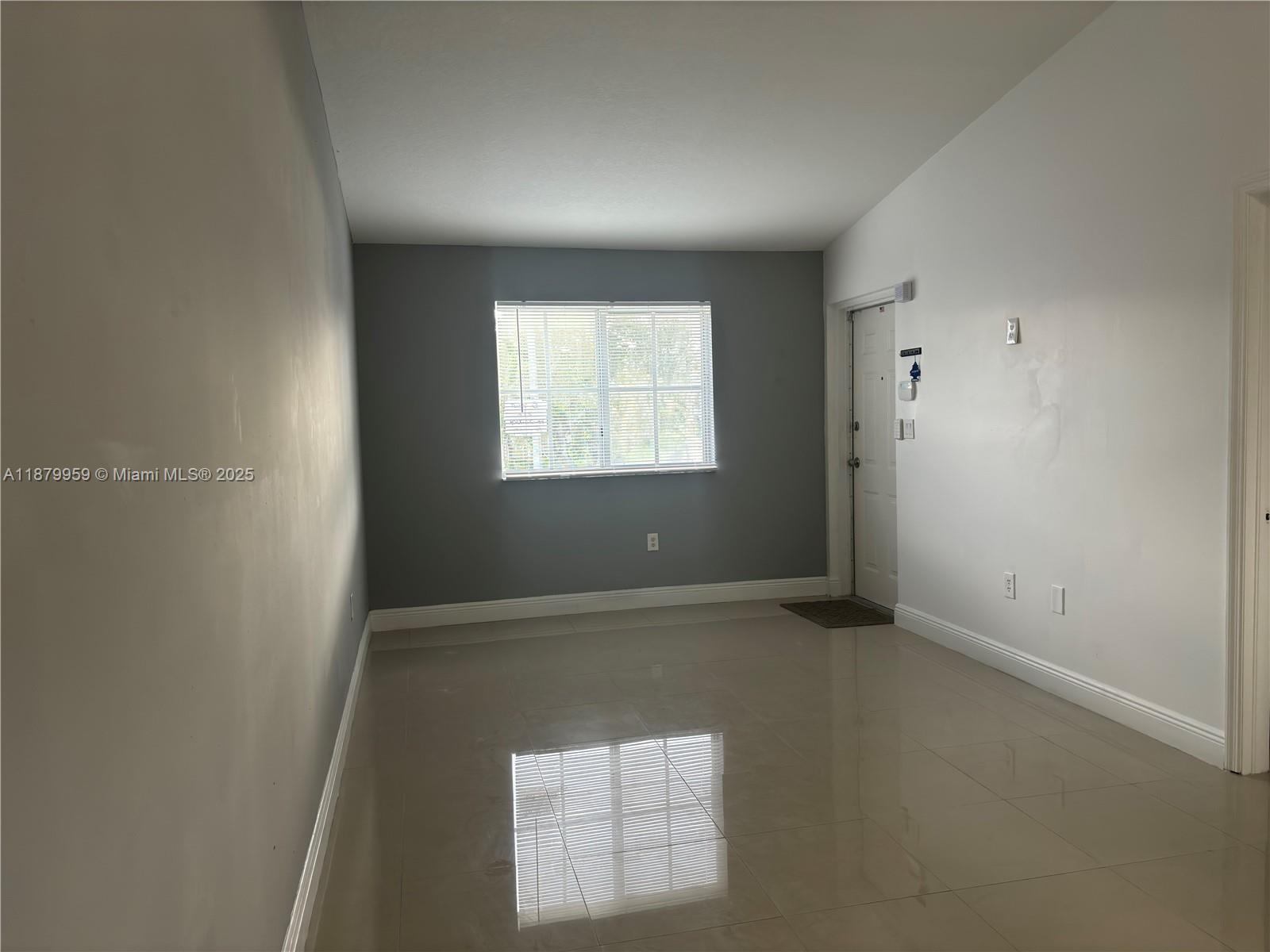 2721 Southeast 12th Place, Unit 205 Homestead, FL 33035 - Photo 9 of 15 Living Room