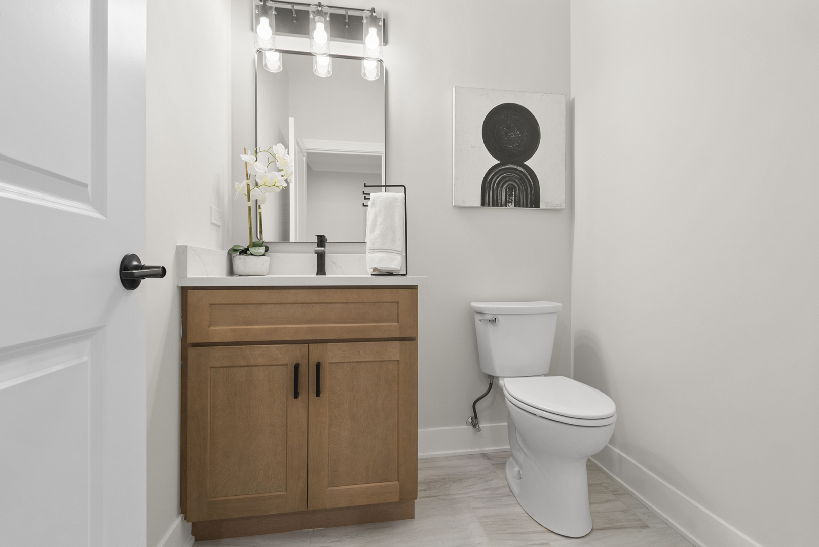 11325 1st Street Mokena, IL 60448 - Photo 14 of 34 a bathroom with a granite countertop toilet sink and mirror