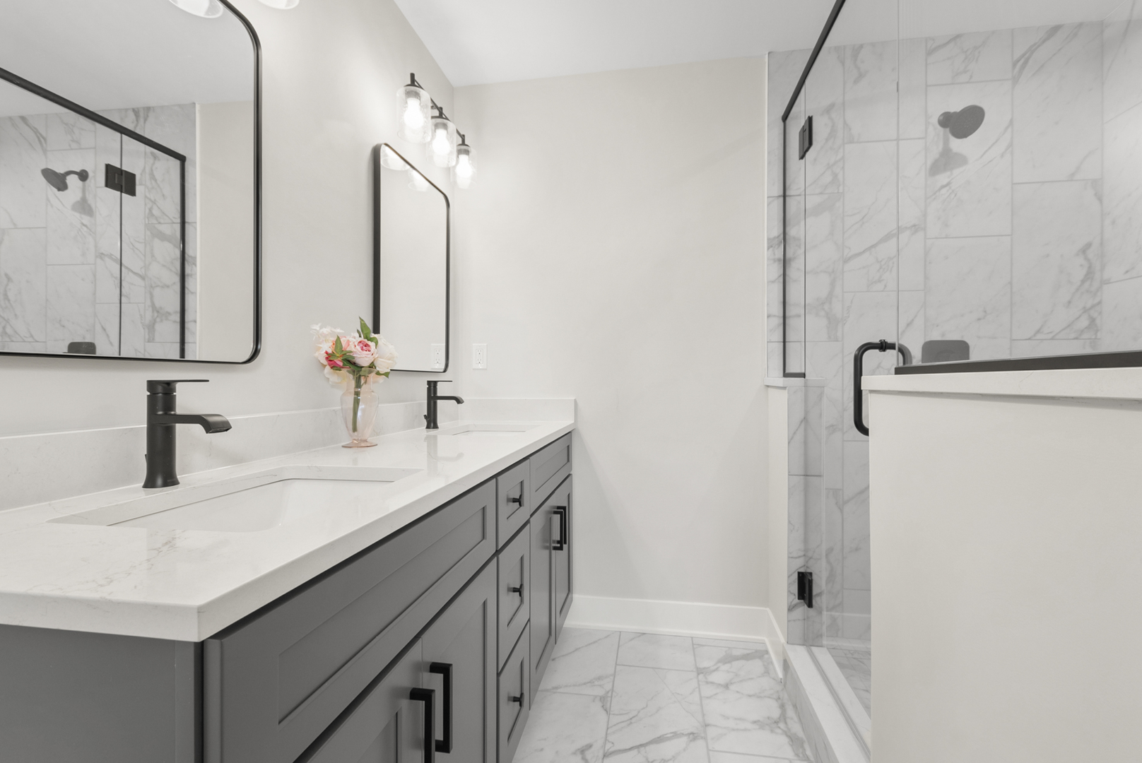 11325 1st Street Mokena, IL 60448 - Photo 19 of 34 a bathroom with a double vanity sink a mirror and shower