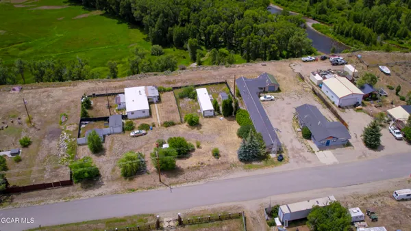 an aerial view of a house with a garden