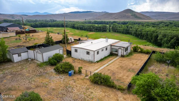 an aerial view of a house with a garden