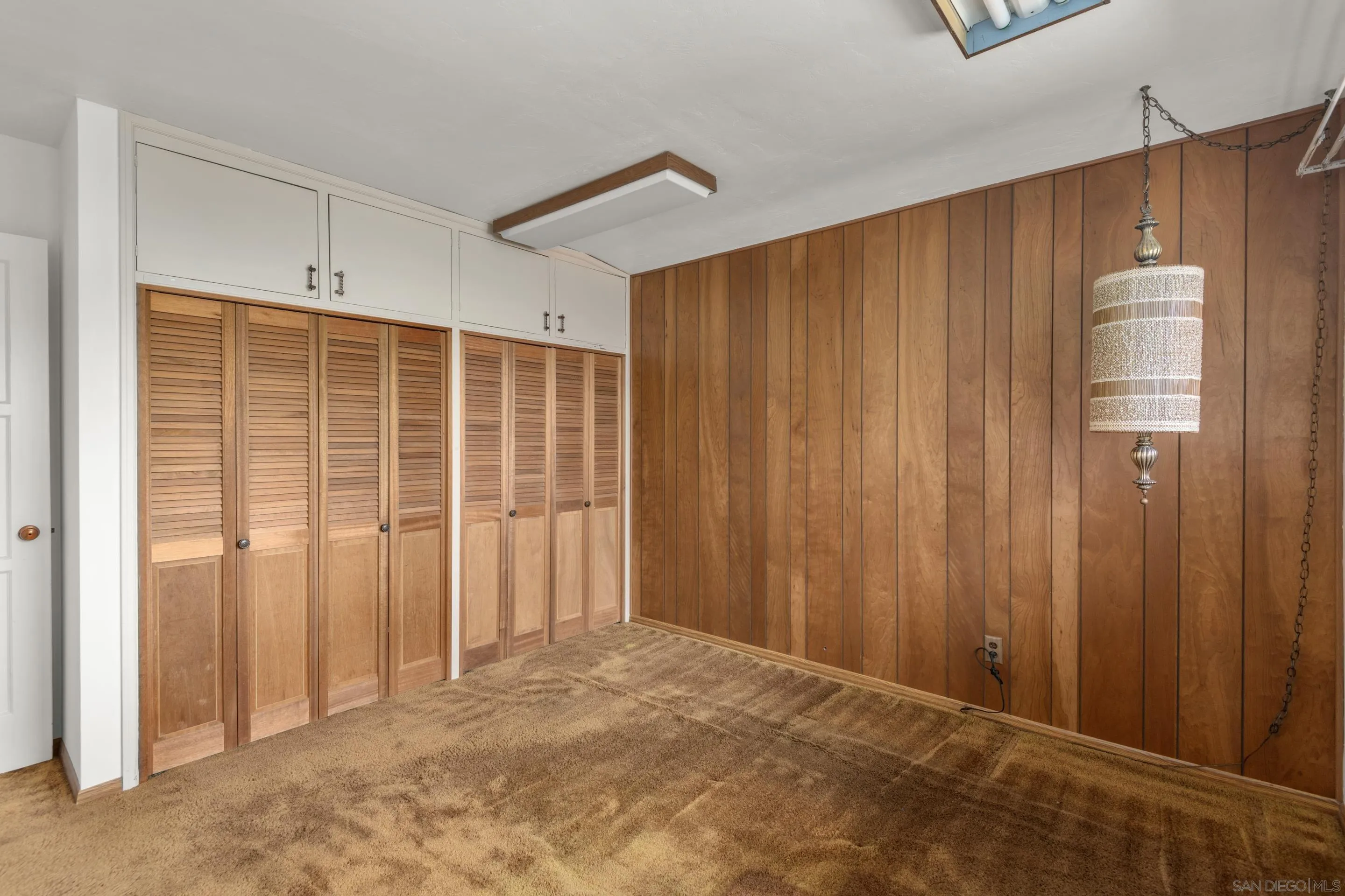 486 Murray Drive El Cajon, CA 92020 - Photo 16 of 23 a view of an empty room with wooden walls