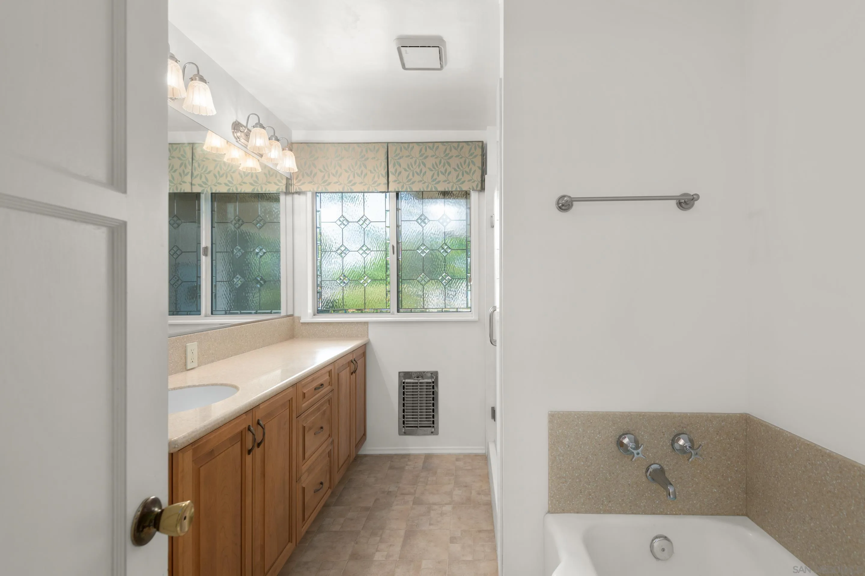 486 Murray Drive El Cajon, CA 92020 - Photo 17 of 23 a bathroom with a bathtub and a sink