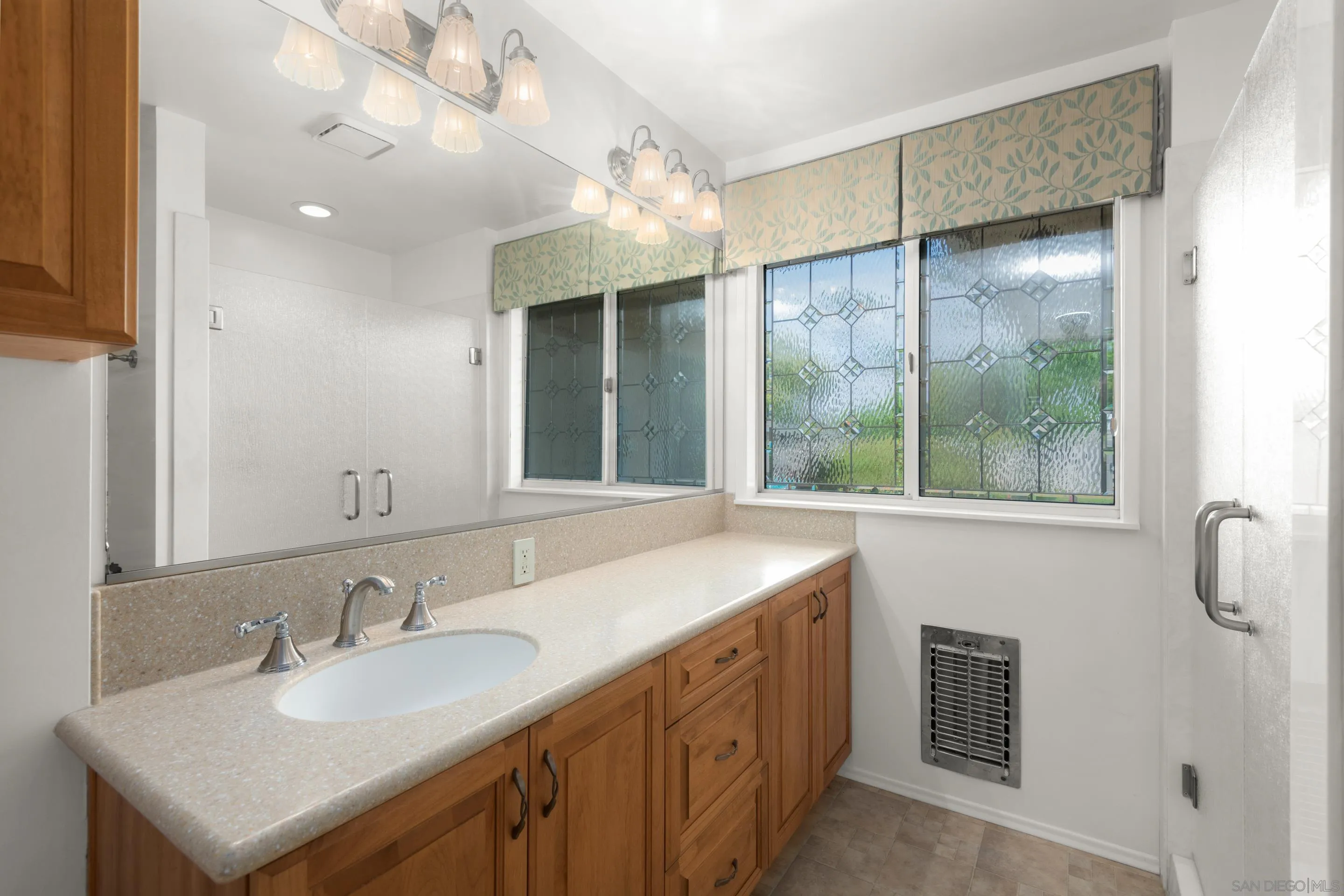 486 Murray Drive El Cajon, CA 92020 - Photo 18 of 23 a bathroom with a double vanity sink and a mirror