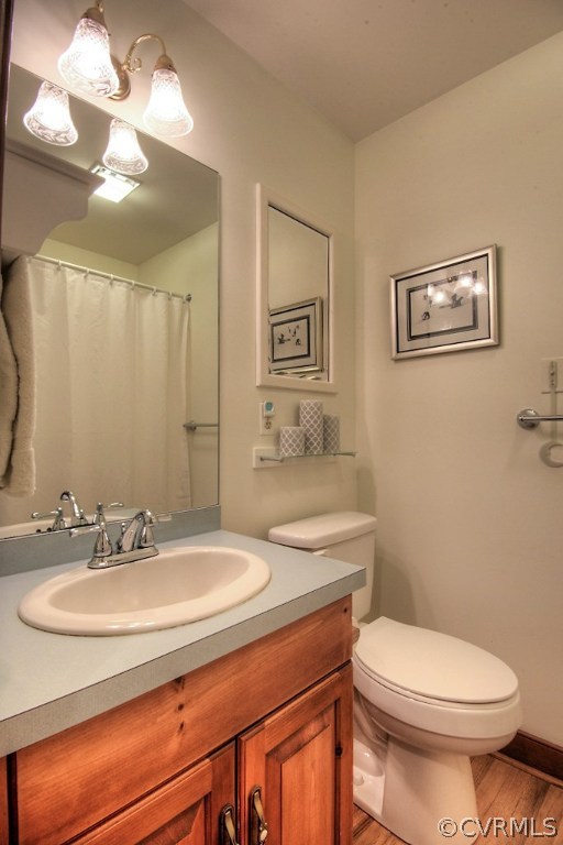 5502 Manitoba Road Chesterfield, VA 23832 - Photo 32 of 48 a bathroom with a sink a toilet and a mirror