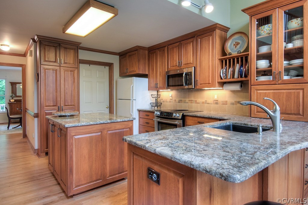 5502 Manitoba Road Chesterfield, VA 23832 - Photo 4 of 48 a kitchen with stainless steel appliances granite countertop a kitchen island a stove and a sink