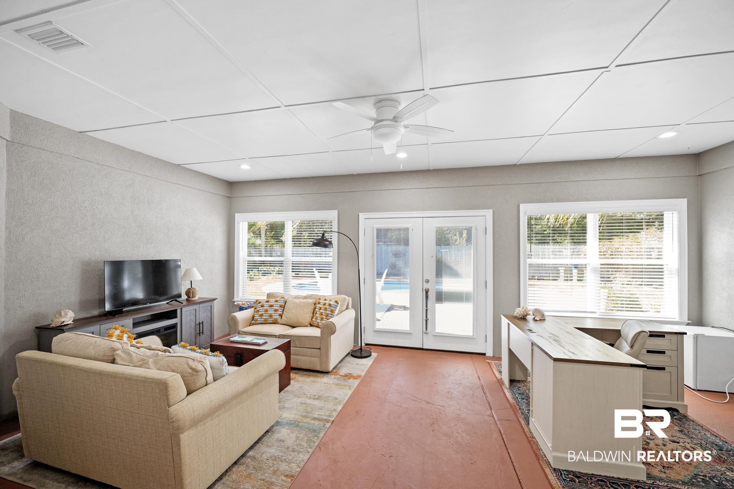 5217 Greentree Road Orange Beach, AL 36561 - Photo 19 of 58 Living room featuring french doors, plenty of natural light, ceiling fan, finished concrete floors, and recessed lighting