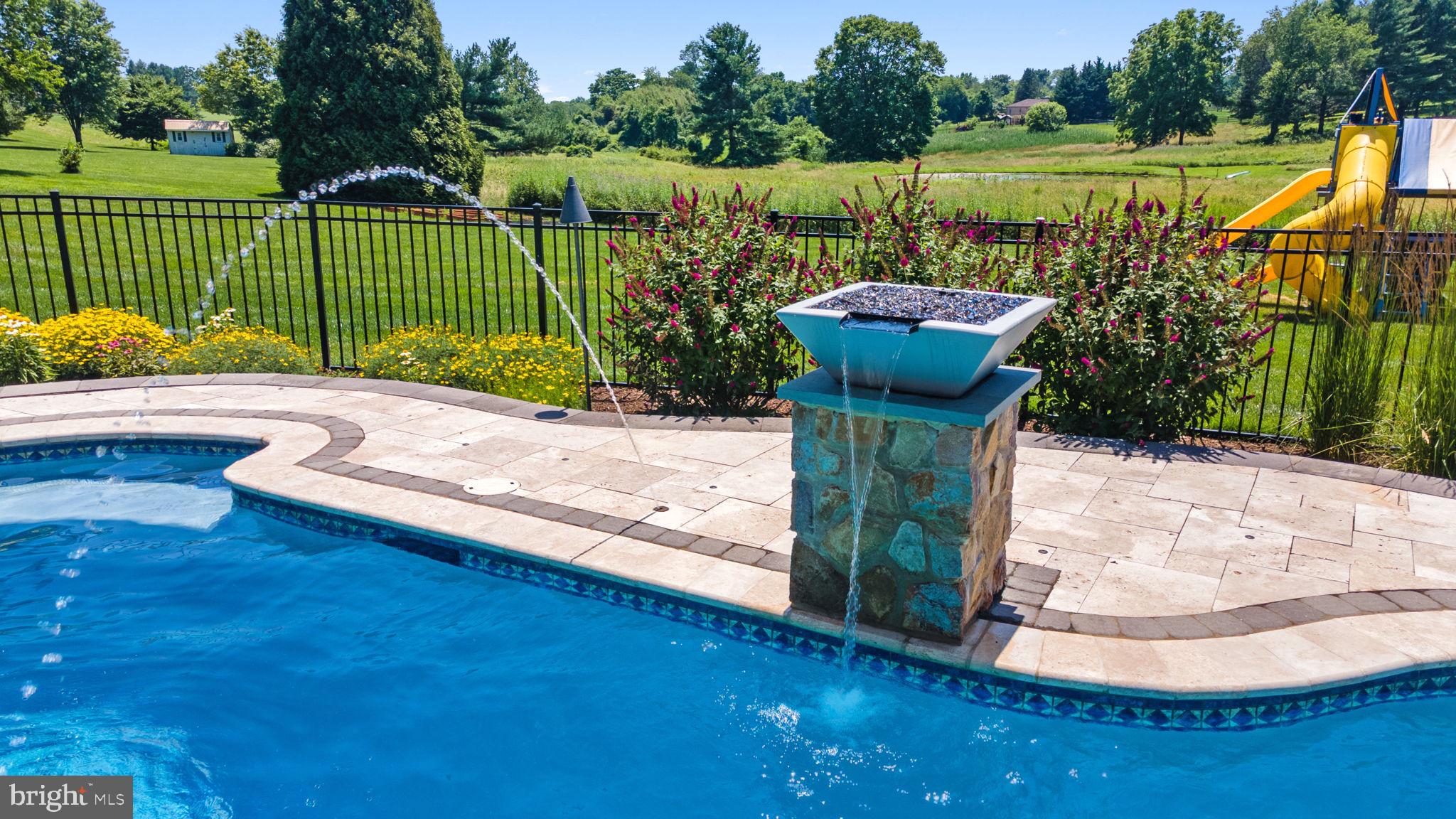 224 Laurel Heights Road Landenberg, PA 19350 - Photo 68 of 95 a view of a swimming pool with a patio and a garden