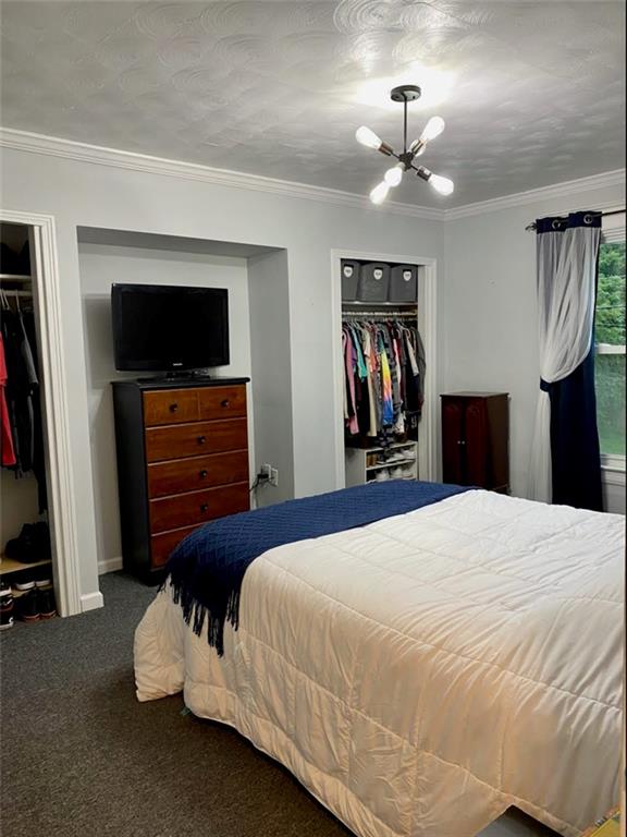 234 Marwood Road Cabot, PA 16023 - Photo 17 of 22 a bedroom with a bed and a flat tv screen on dresser