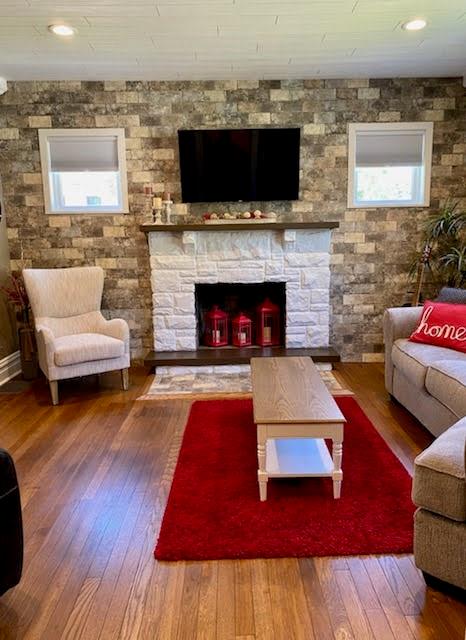 234 Marwood Road Cabot, PA 16023 - Photo 7 of 22 a living room with furniture and a fireplace