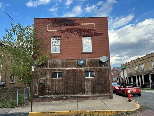 a front view of a building with street view