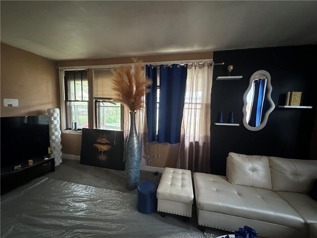 200 Copeland Street McKees Rocks, PA 15136 - Photo 14 of 39 a living room with furniture a flat screen tv and a fireplace