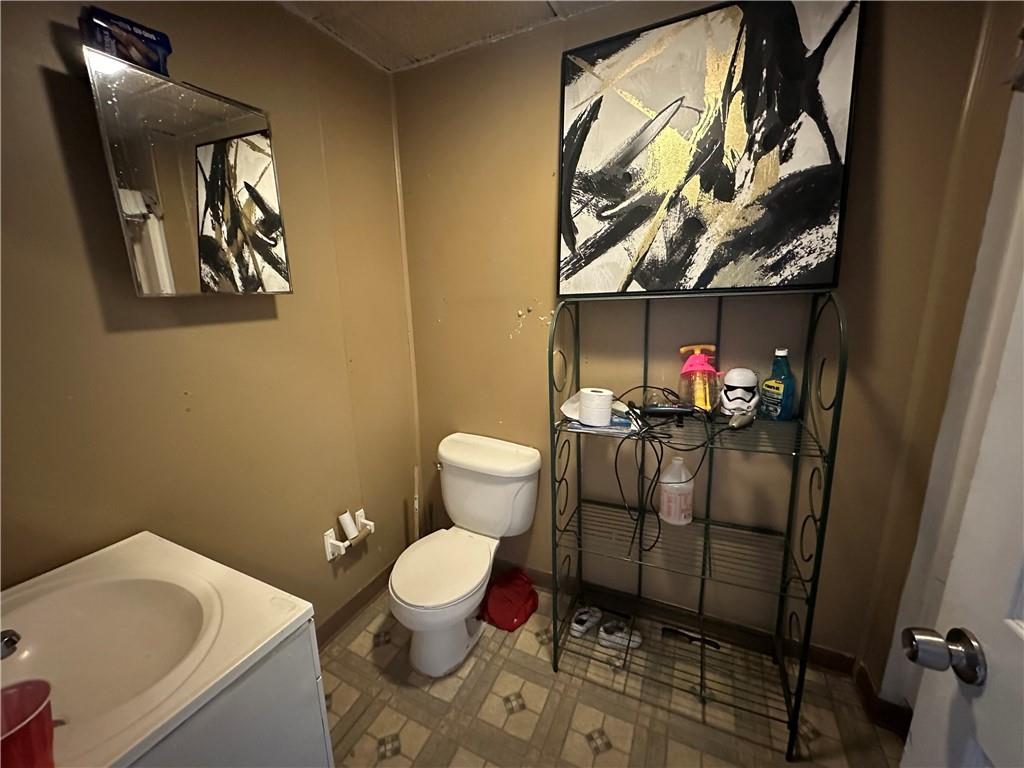 200 Copeland Street McKees Rocks, PA 15136 - Photo 34 of 39 a bathroom with a toilet sink and mirror