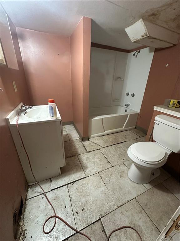 200 Copeland Street McKees Rocks, PA 15136 - Photo 35 of 39 a white toilet sitting next to a bathroom sink and vanity