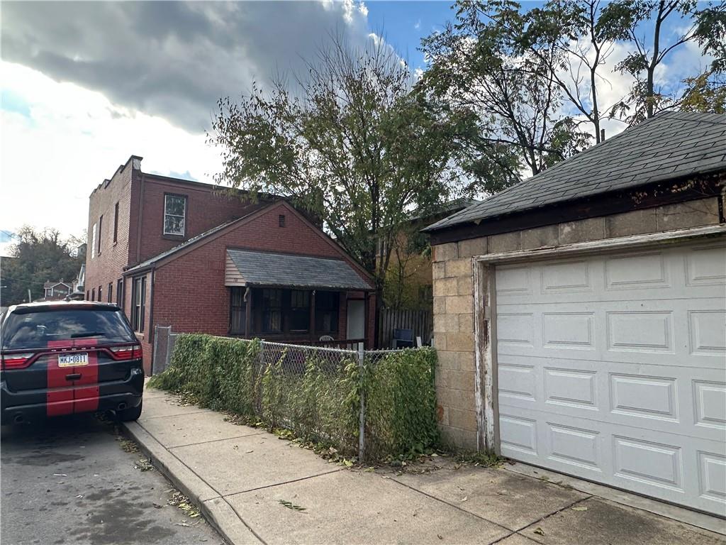 200 Copeland Street McKees Rocks, PA 15136 - Photo 8 of 39 a car parked in front of a house