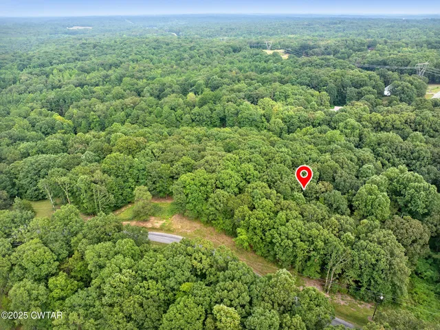 a view of a field with an outdoor space