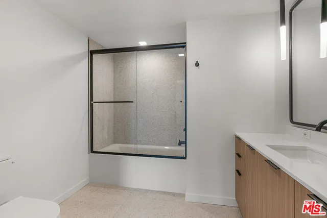 a bathroom with a sink and mirror