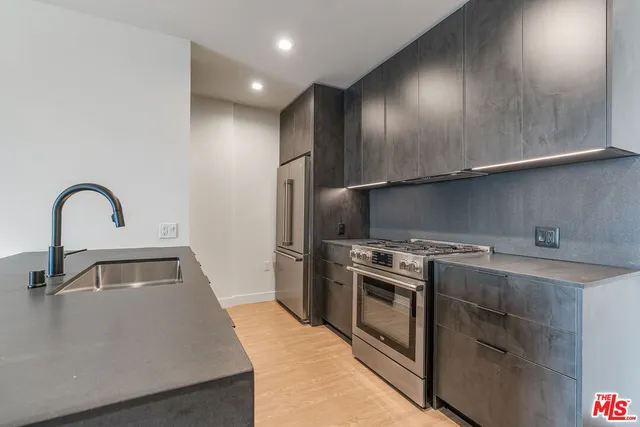 a kitchen with a stove and a sink