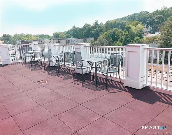 a view of a chairs and table on the terrace