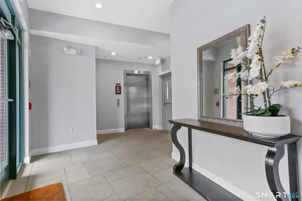 a view of a living room and entryway