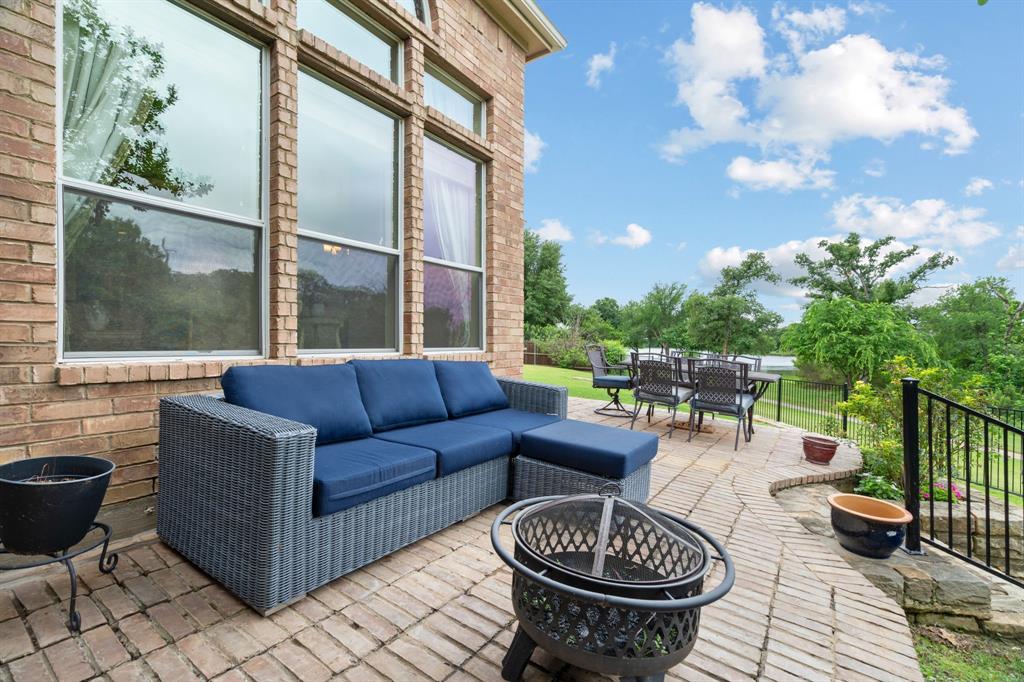 2703 Pottery Trail Corinth, TX 76210 - Photo 30 of 40 a living room with patio furniture and a potted plant