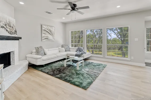 a living room with furniture and a fireplace