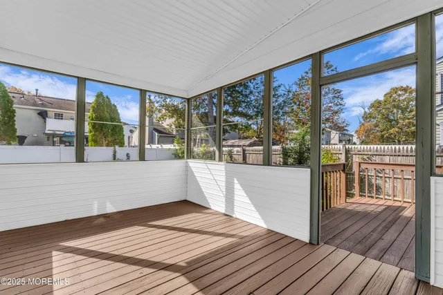 a view of balcony with wooden floor