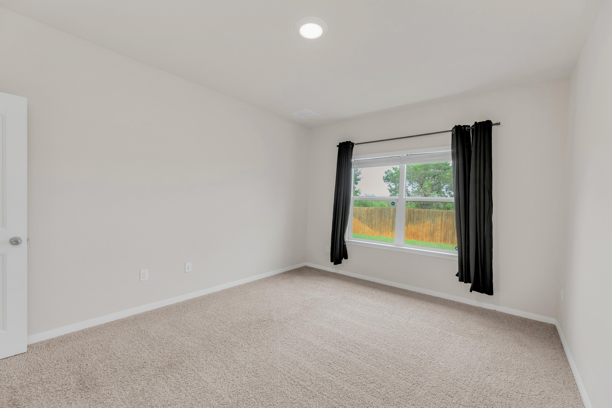 2900 Tweedy Trail Pflugerville, TX 78660 - Photo 12 of 33 Carpeted spare room featuring baseboards