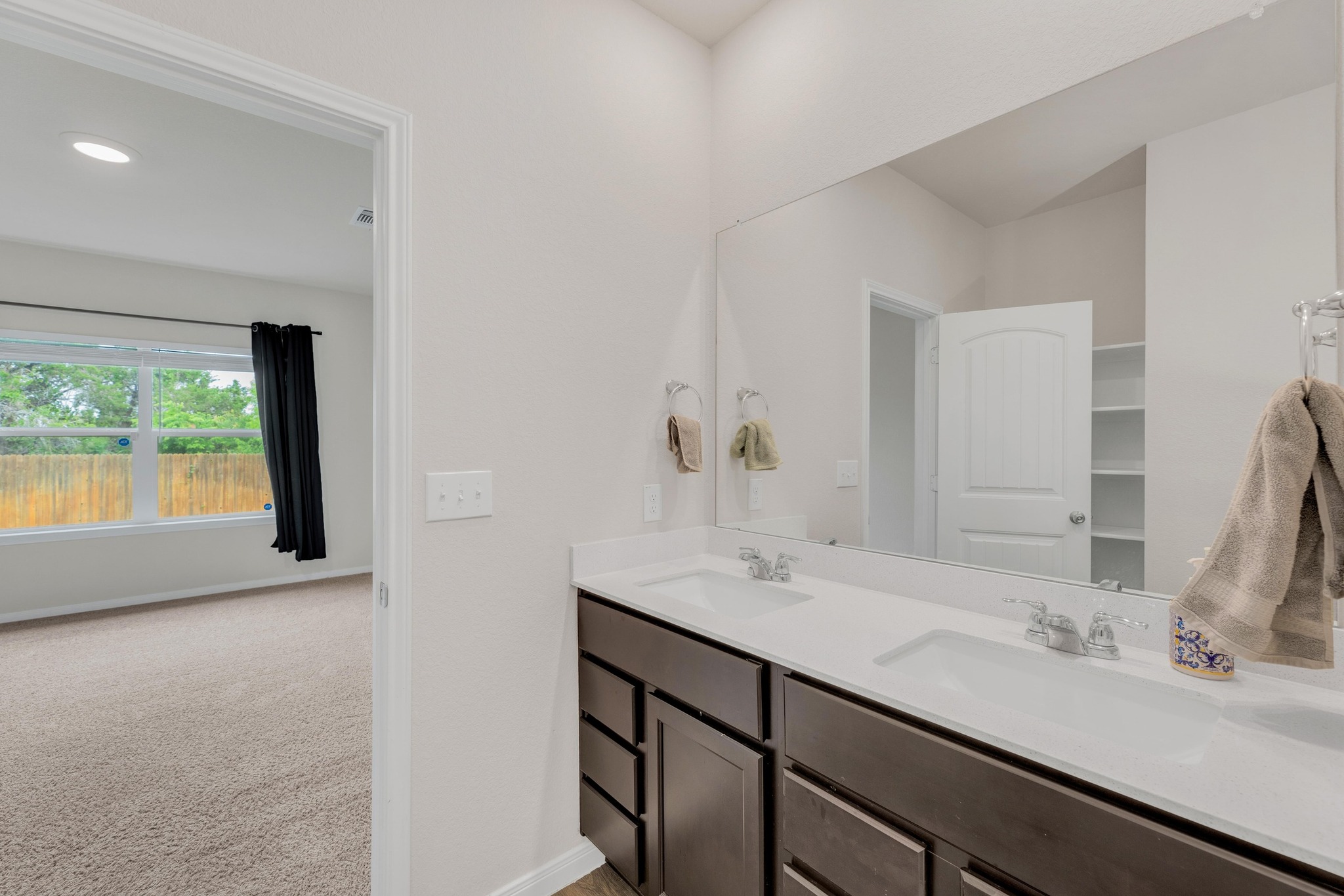2900 Tweedy Trail Pflugerville, TX 78660 - Photo 15 of 33 Bathroom with baseboards, double vanity, and recessed lighting