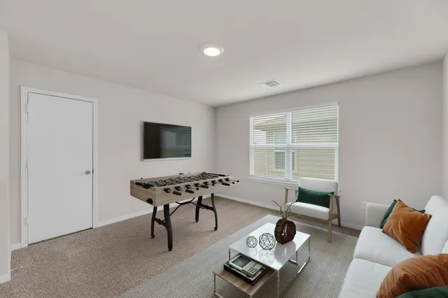 a living room with furniture and a window