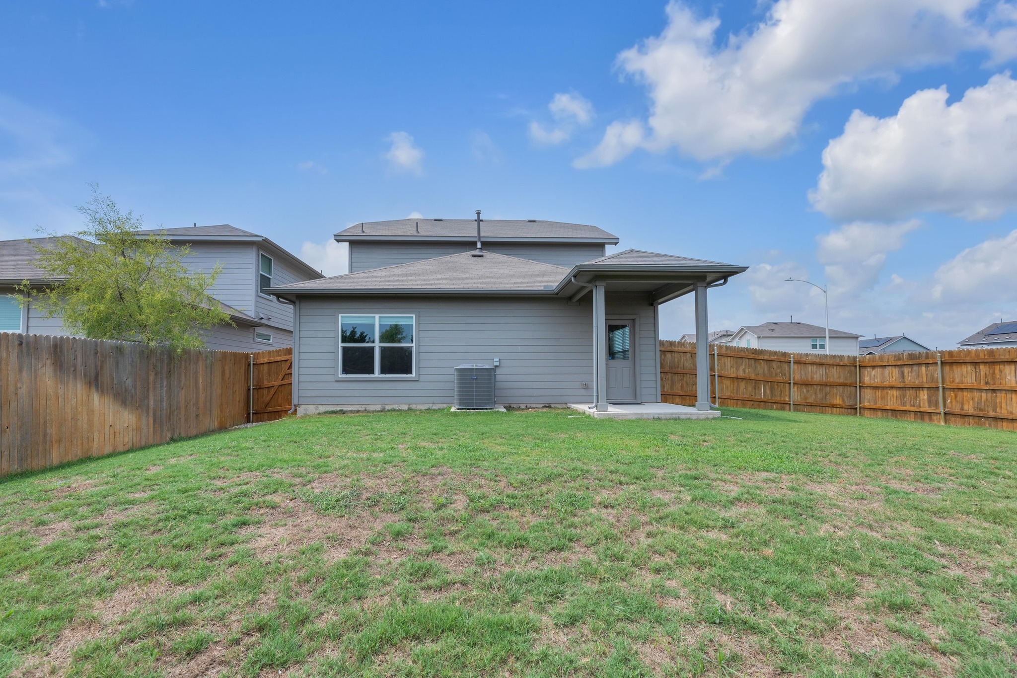 2900 Tweedy Trail Pflugerville, TX 78660 - Photo 23 of 33 Rear view of house featuring cooling unit and a patio area