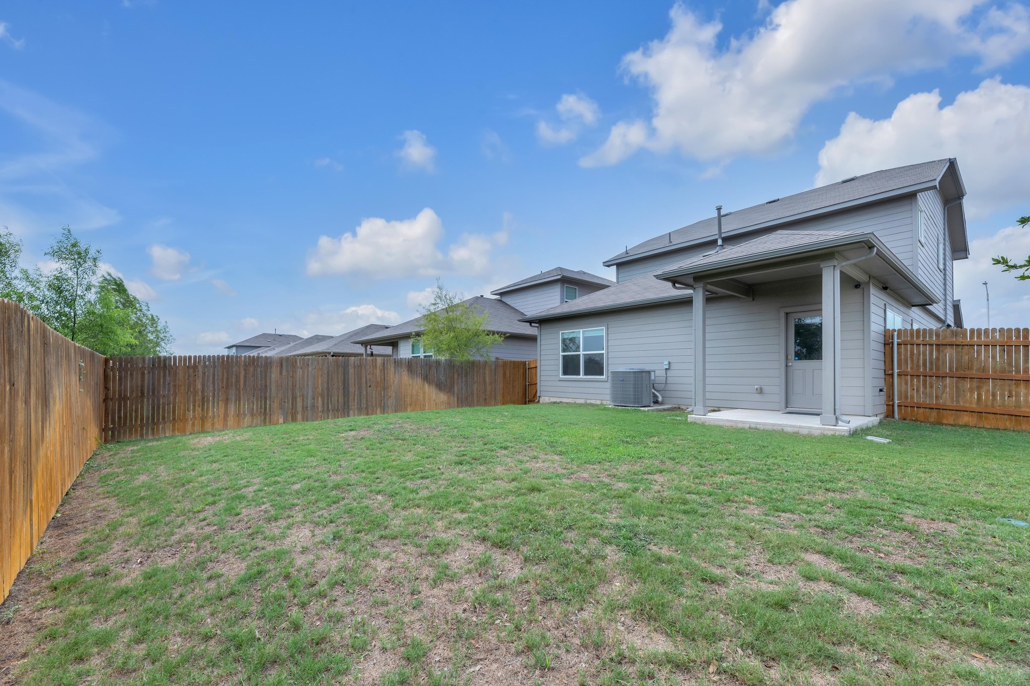 2900 Tweedy Trail Pflugerville, TX 78660 - Photo 25 of 33 View of yard featuring central AC and a patio