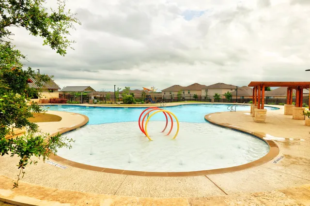 a view of a swimming pool with a garden