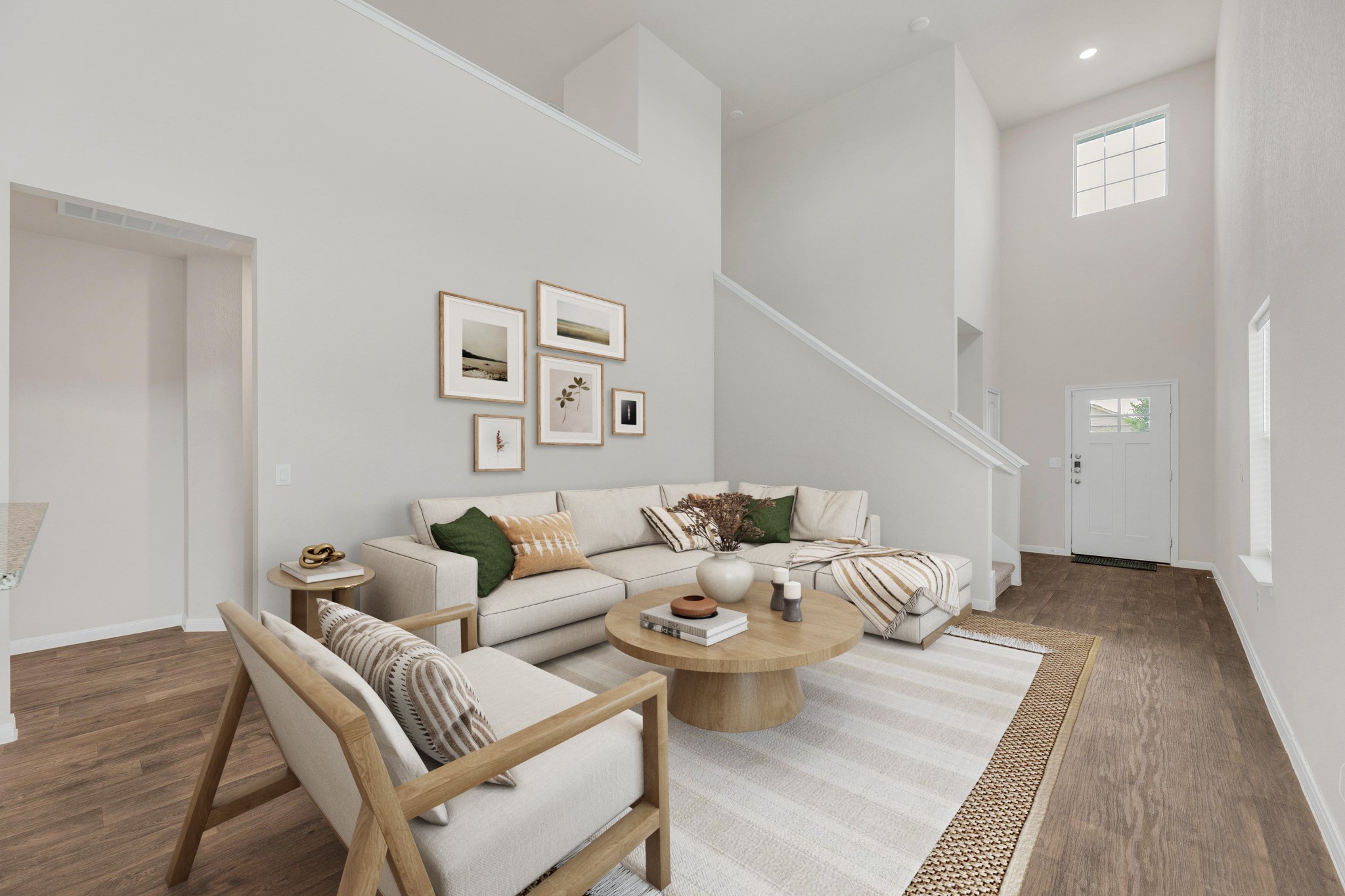 2900 Tweedy Trail Pflugerville, TX 78660 - Photo 3 of 33 Living area with a towering ceiling, wood finished floors, stairs, baseboards, and recessed lighting